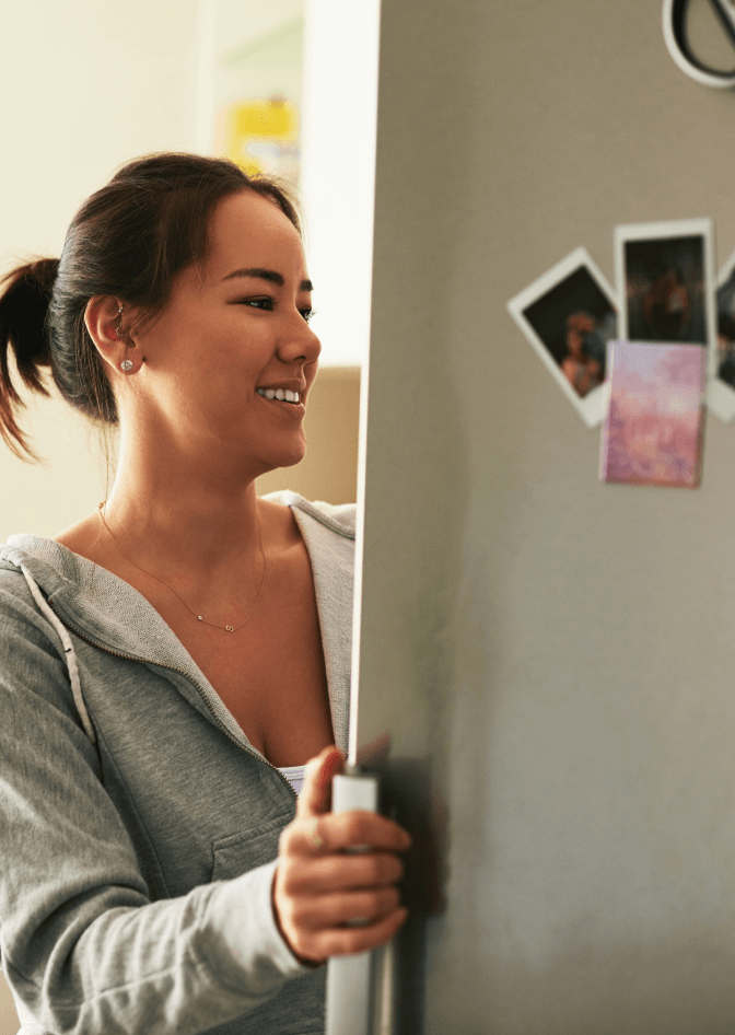 A person empties their dryer